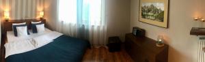 Łóżko lub łóżka w pokoju w obiekcie Apartament Granat
