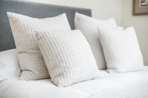 A bed or beds in a room at The Firs 