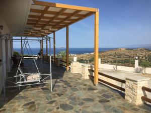a pavilion with a view of the ocean at Villas Alexandros in Kalamaki