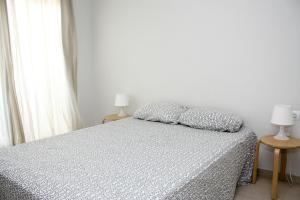 Giường trong phòng chung tại Ático Avda del Mar Inmomart