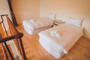 Voodi või voodid majutusasutuse Sasa Nor Lamour B&B toas