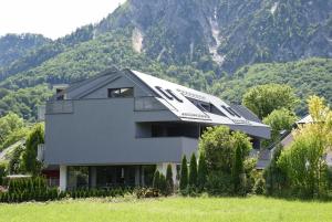 a house in front of a mountain at Villa Landlust in Sankt Leonhard