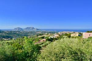 a village on a hill with the ocean in the background at * * * VILLA ANNALISA * * * in Casteldaccia