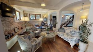 a living room with couches and a table at Hotel Boutique MR Palau Verd - Adults Only in Denia