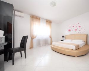 Postel nebo postele na pokoji v ubytování Resort la Magnolia
