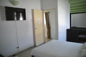 Postel nebo postele na pokoji v ubytování Hotel Albatros