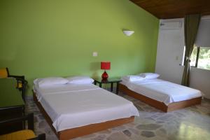 Postel nebo postele na pokoji v ubytování Hotel Albatros