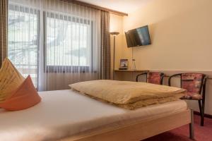 Letto o letti in una camera di Hotel Alex