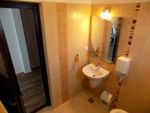 a bathroom with a sink and a mirror at Daiana Residence Turda in Turda +78 photos