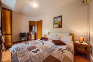 Postel nebo postele na pokoji v ubytování Maria Guest House
