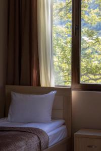 Letto o letti in una camera di Hotel Patriot