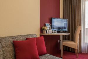 TV o dispositivi per l'intrattenimento presso Hotel Alex