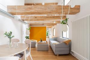 a living room with a couch and a table at Apartamenty Monka in Toruń +54 photos