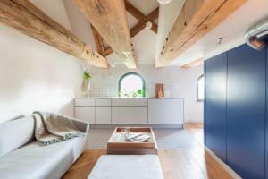a living room with a couch and a table at Apartamenty Monka in Toruń