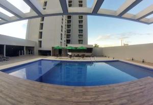 a large swimming pool in a large building at Crystal Place 2 in Goiânia