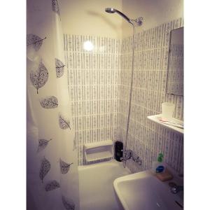 a bathroom with a shower and a sink at Loutraki Suites in Loutraki +17 photos