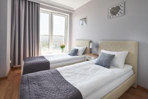 Postel nebo postele na pokoji v ubytování Apartament Premium Aquatower Reda