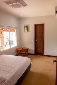 Letto o letti in una camera di Hostal Aurora, Smith Lodging