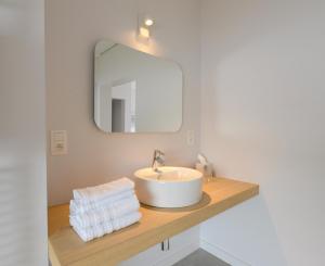 a bathroom with a sink and a mirror at B&B Villa Chantecler in Bruges +22 photos