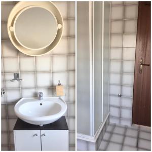 a bathroom with a sink and a mirror at Sobe Bosiljka in Nin