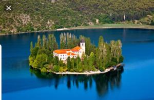 a house on an island in the middle of a lake at Kuća za odmor - My Soul in Šibenik