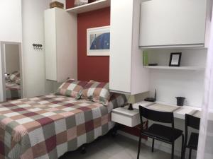 Rúm í herbergi á Cosy studio in Copacabana