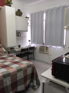 Rúm í herbergi á Cosy studio in Copacabana