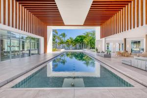 an infinity pool in a house with a living room at Senator Puerto Plata in San Felipe de Puerto Plata