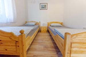 Posteľ alebo postele v izbe v ubytovaní Zsoryka Vendégház