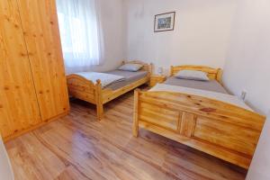 Posteľ alebo postele v izbe v ubytovaní Zsoryka Vendégház