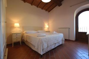 Ένα ή περισσότερα κρεβάτια σε δωμάτιο στο Borgo Gatteraia