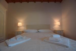 Ένα ή περισσότερα κρεβάτια σε δωμάτιο στο Borgo Gatteraia
