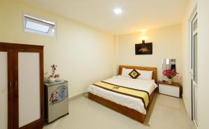 Postel nebo postele na pokoji v ubytování An Phu Hotel Da Lat