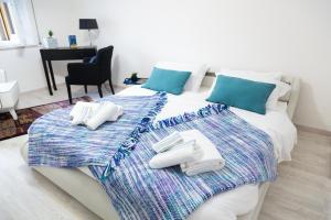 A bed or beds in a room at MiKlod Apartments