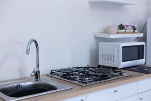 A kitchen or kitchenette at MiKlod Apartments