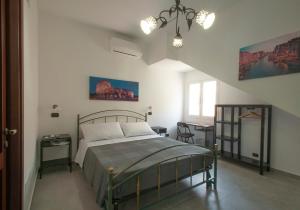 Postel nebo postele na pokoji v ubytování B&b Vittoria House + 37 fotografií
