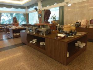 a room with a counter with food on it at Yi Yuan Resort in Fengping