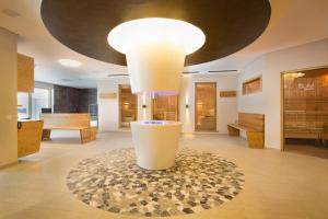 a large room with a large light on the ceiling at Ferienwohnung Jasmin in Oberstdorf