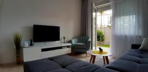 TV a/nebo společenská místnost v ubytování Apartment Sunce