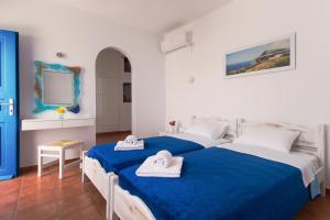 Postel nebo postele na pokoji v ubytování Aegeo Hotel