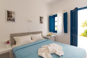 Postel nebo postele na pokoji v ubytování Aegeo Hotel