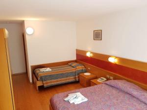 Cama ou camas em um quarto em Hotel Miramonti