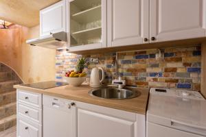 Kuchyň nebo kuchyňský kout v ubytování Apartman Verbenia