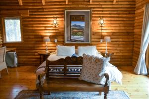Posezení v ubytování Clarens Log Cabin