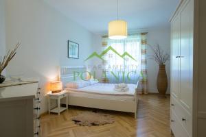 Posteľ alebo postele v izbe v ubytovaní Parkowa Polana - PolanicaApartamenty