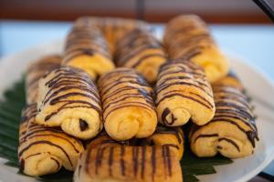 a bunch of pastries on a plate on a table at Railay Village Resort in Railay Beach