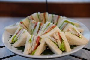 a plate of sandwiches sitting on a table at Railay Village Resort in Railay Beach