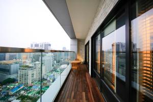 a balcony with a view of a city at Solaria Nishitetsu Hotel Seoul Myeongdong in Seoul