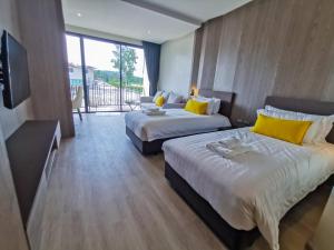 Postel nebo postele na pokoji v ubytování De VeraNiO Resort