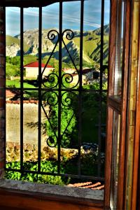 a window with a view of a mountain view at La Cabada in Ortiguero